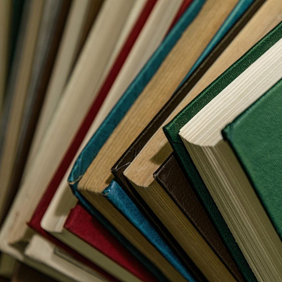 Stack of old books with textured leather covers